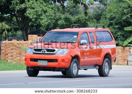 CHIANGMAI, THAILAND -AUGUST 8 2015: Pickup truck of Tot company.Intenet and Telephone Service in Thailand. Photo at road no.121 about 8 km from downtown Chiangmai, thailand.
