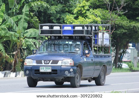 CHIANGMAI, THAILAND -AUGUST 8 2015:  : Drinking water delivery truck of Rich company. Photo at road no.1001 about 8 km from downtown Chiangmai, thailand.