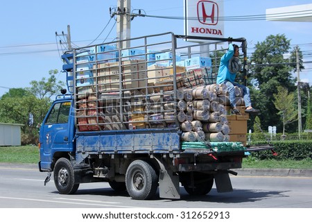 CHIANGMAI, THAILAND -AUGUST 10 2015:    Truck of Saha Thip Thong Transport company. Photo at road no.121 about 8 km from downtown Chiangmai, thailand.