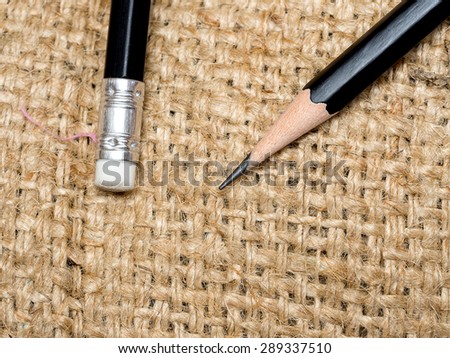 Closeup pencil eraser on sand bag
