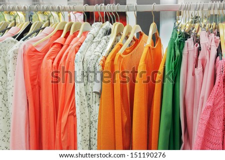 A row of clothes hanging on the rack