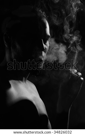 Smoker silhouette over black background
