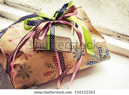 gifts with packaging paper and atlas bows/vintage holiday background