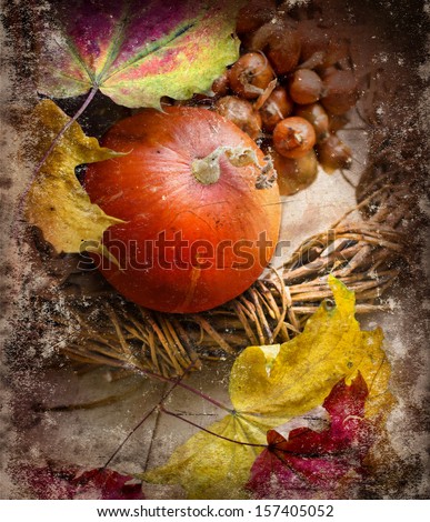 Textured Autumn background with pumpkins and autumn leaves on wooden table/Thanksgiving day concept