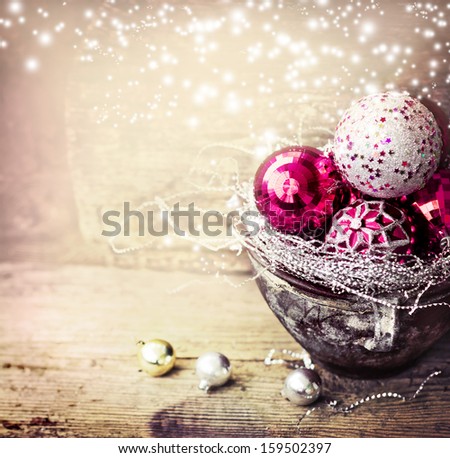 Vintage Christmas Ornament Background/ Christmas decorations in old pot on textured wooden background/ Composition with Brilliant  Christmas Balls