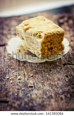 Vintage  piece of Cake on wooden background/ Slice of tasty  cake