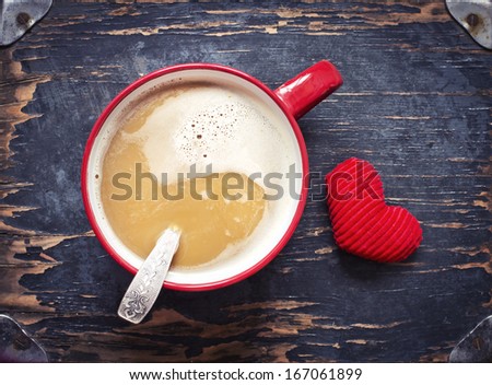 Red Cup of cacao and little heart on dark textured background/ Valentines day background