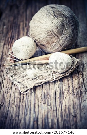 Vintage Knitting needles and yarn on wooden background/natural wool knitting background