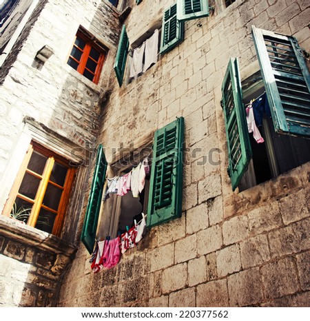 old charming streets/ Old town in Europe / old dirty windows on old dirty wall