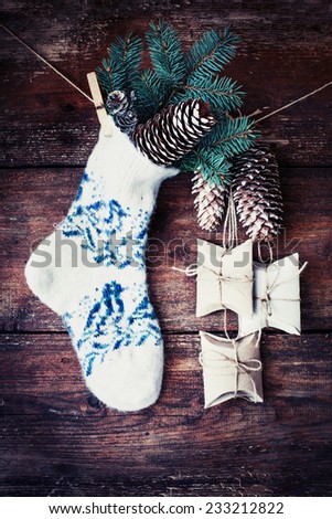 christmas composition with socks, present boses fir and fir-cone on wooden background/ Christmas card with christmas rustic decorations