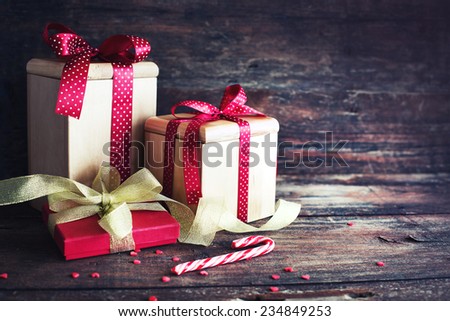 Christmas presents on dark wooden background in vintage style