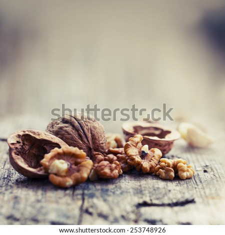 Almonds, walnuts and hazelnuts on wooden table / assortment of nuts