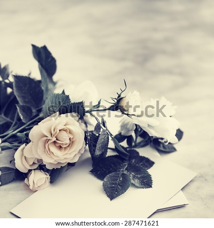 White roses on the old wooden background/ Vintage holidays bouquet