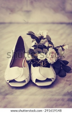 Photo of white shoes and rose flowers/ WEdding background