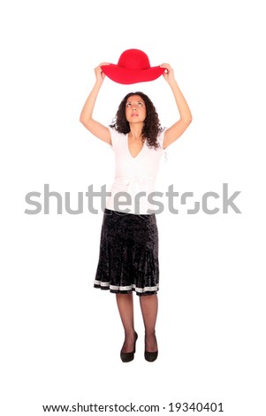 A woman put off her red hat, standing on white background.
