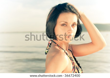 Portrait of a calm Georgian woman in bikini. Sepia tones