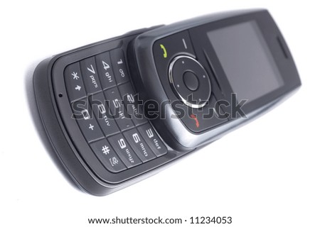 Small and modern mobile phone isolated on white background, opened with keypad