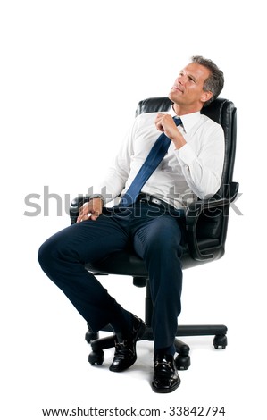 Dreamful pensive businessman sit on his business chair isolated on white background