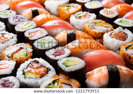 Overhead japanese sushi food. Maki ands rolls with tuna, salmon, shrimp, crab and avocado. Top view of assorted sushi, all you can eat menu. Rainbow sushi roll, uramaki, hosomaki and nigiri. 