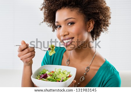 woman eating vegetable salad healthy food