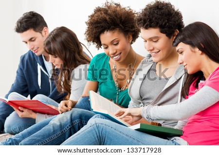 Group Of Happy Young Friends Studying Together