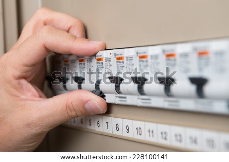 Closeup Of Person's Hand Repair The Switchboard Foto d'archivio © 