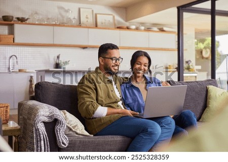 Similar – Image, Stock Photo Couple looking at laptop in kitchen.