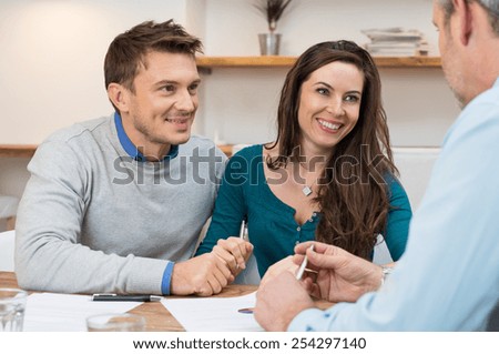 Young couple meeting financial advisor for investment