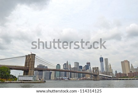 View to Brooklyn Bridge and Lower Manhattan in New York, with the Freedom Tower in the background