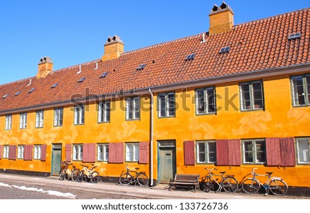 Panorama view of a typical orange house in Nyboder which is a historic row house district of former Naval barracks and was built by King Christian IV