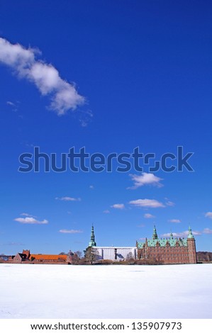 The castle lake with Frederiksborg Castle in the background which is the largest Renaissance Castle in Scandinavia