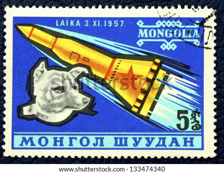 MONGOLIA - CIRCA 1957: A stamp printed in the Mongolia, shows the soviet rocket and dog Laika, circa 1957