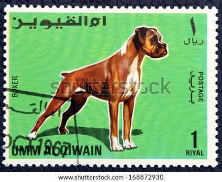 UMM AL QUWAIN (UAE) - CIRCA 1967: A stamp printed in the Umm Al Quwain (UAE), shows the dog, circa 1967