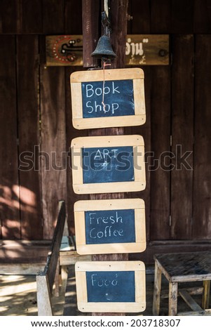 Book shop and coffee label frame on brown wood plank background