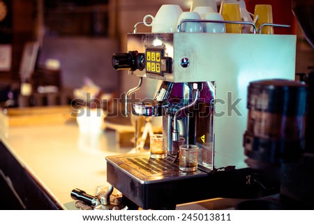 Close up of professional coffee machine making espresso in a cafe, Film look process