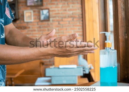 Similar – Image, Stock Photo doctor man using alcohol disinfectant gel. using protective mask and gloves during corona virus covid 2019 pandemic. Health care and medical concept