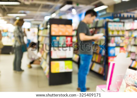 Blur image of People reading and shopping book in book store