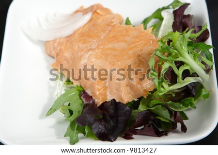 Alaskan smoked sockeye salmon starter on a bed of lettuce