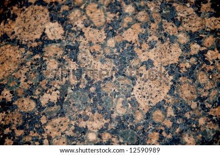 Image of a black and tan/pink patterened granite close up