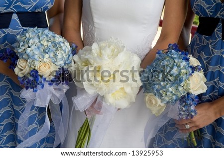 An image of bride and bridesmaids with bouquets