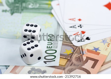 Pair of dices and playing cards over euro money