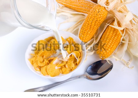 Corn flakes served for breakfast on white background