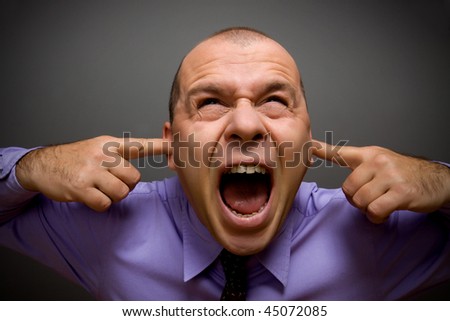 Adult Businessman Screaming In Pain Over Gray Background Stock Photo ...
