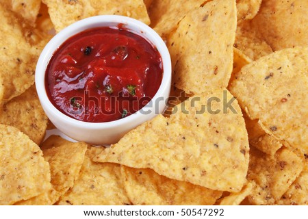 Tortilla chips with hot Mexican salsa dip