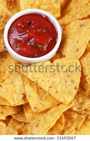 Tortilla chips with hot salsa dip sauce