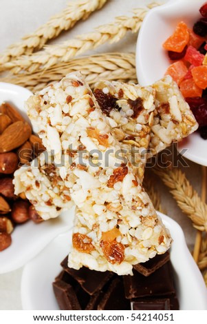 Granola, protein bar with dried fruit, nuts and chocolate
