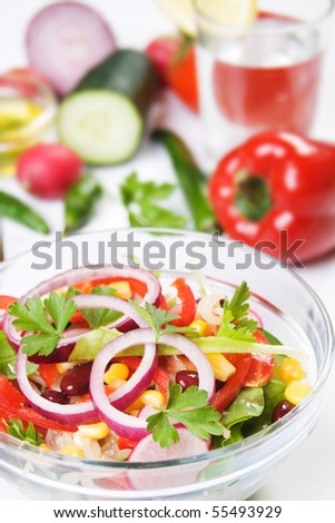Delicious spring salad with onion, corn,tomato, pepper, kidney beans and other vegetable