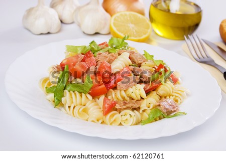 Classic tuna meat, pasta, tomato and lettuce salad