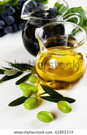 Olive oil and balsamic vinegar on white background