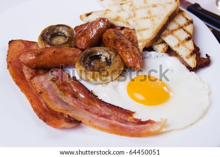 Traditional english breakfast food served on white plate
